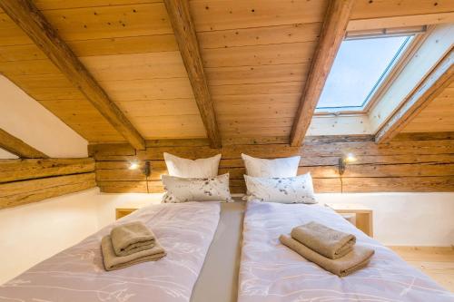 a bedroom with two beds in a attic at Ferienwohnung Weitblick in Eggstätt