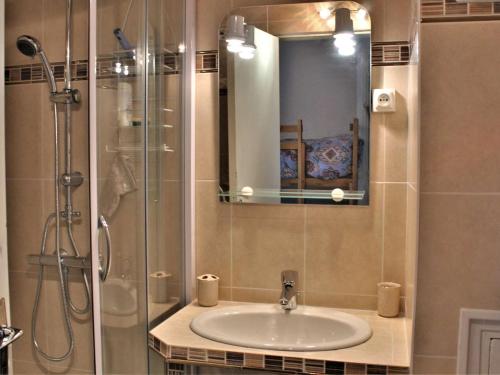 a bathroom with a sink and a shower at Appartement Risoul, 1 pièce, 4 personnes - FR-1-330-156 in Risoul