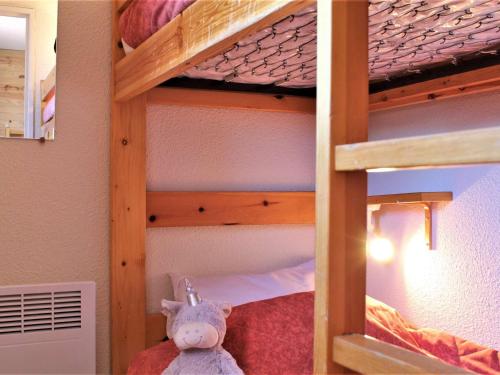 a bunk bed with a stuffed animal on the bottom bunk at Studio cabine au calme, pieds des pistes, 4 couchages - Risoul 1850 - FR-1-330-234 in Risoul