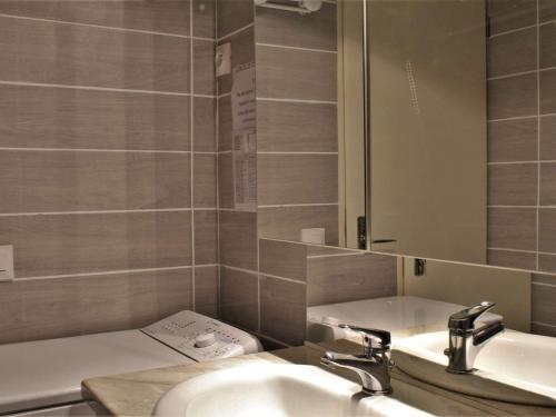 a bathroom with a sink and a toilet and a mirror at Studio cabine au calme, pieds des pistes, 4 couchages - Risoul 1850 - FR-1-330-234 in Risoul