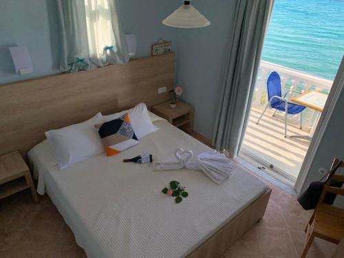 a bedroom with a bed with a view of the ocean at Clear Horizon in Amoudi