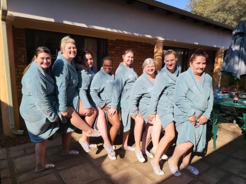 a group of people in blue robes posing for a picture at Guesthouse Serenity in Hartbeespoort