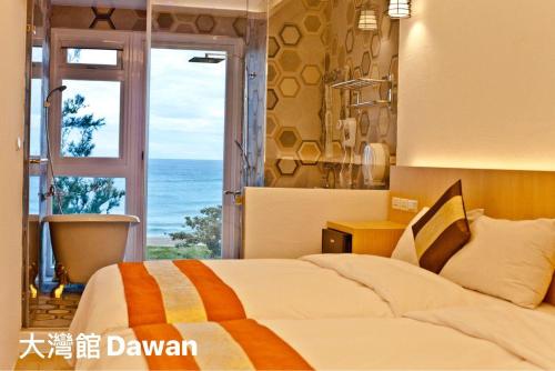 Postel nebo postele na pokoji v ubytování Kenting Dawan Homestay