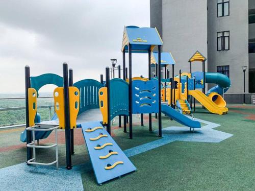 a playground with a blue and yellow slide at D'pristine by Antlerzone in Johor Bahru