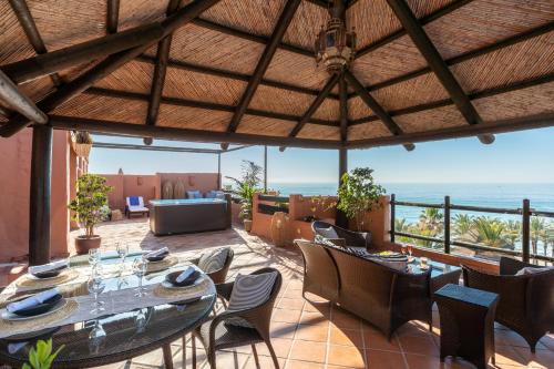 a dining room with a view of the ocean at Kempinski Hotel Bahía Beach Resort & Spa in Estepona