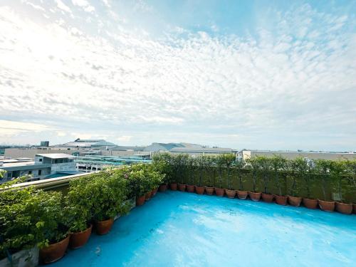 a swimming pool on the roof of a building at The Island Resort in Bangkok