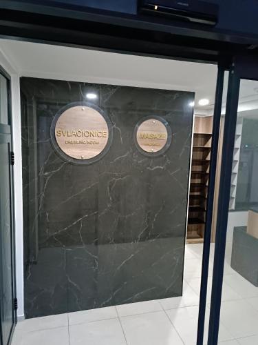a glass door with two stickers on it at President KOP A515 in Kopaonik