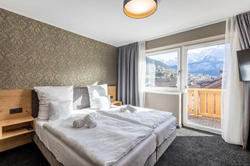 Posteľ alebo postele v izbe v ubytovaní Zugspitz Residence Ehrwald