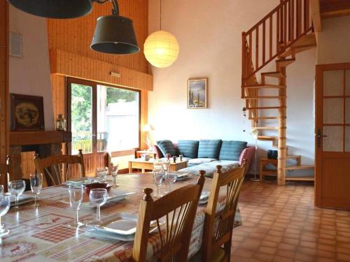 a dining room with a table with wine glasses on it at Appartement Le Grand-Bornand, 3 pièces, 7 personnes - FR-1-241-50 in Le Grand-Bornand