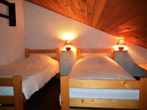 Ένα ή περισσότερα κρεβάτια σε δωμάτιο στο Appartement Le Grand-Bornand, 1 pièce, 6 personnes - FR-1-241-5