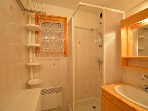 a bathroom with a shower and a sink at Appartement Le Grand-Bornand, 2 pièces, 6 personnes - FR-1-241-17 in Le Grand-Bornand