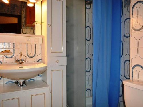a bathroom with a sink and a mirror and a shower at Appartement Le Grand-Bornand, 1 pièce, 4 personnes - FR-1-241-126 in Le Grand-Bornand