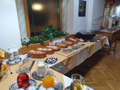 a table with food and drinks on top of it at Kurhotel Renona Rehabilitation in Semmering