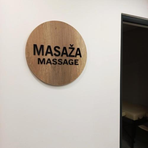 a sign for a masaya massage on a wall at President KOP A515 in Kopaonik