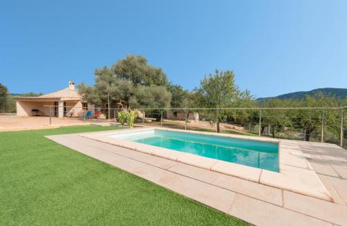 a swimming pool in the yard of a house at Villa Calvià countryside in Calvià