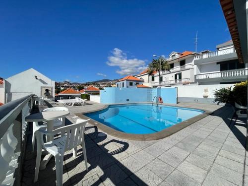 a swimming pool in the middle of a building at Valhalla Panorama in Funchal