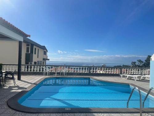 a swimming pool with a view of the ocean at Valhalla Panorama - the old Residencial Pina in Funchal