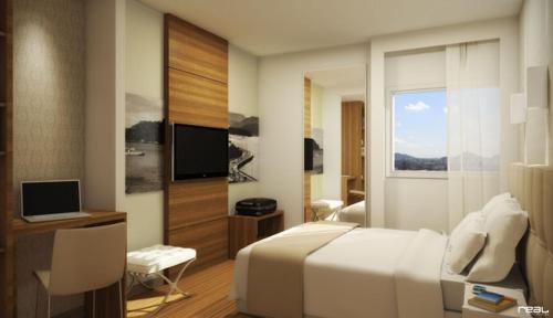 TV a/nebo společenská místnost v ubytování Linhares Design Hotel