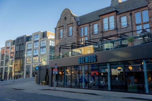 a store on a street in front of buildings at BrewDog DogHouse Edinburgh in Edinburgh