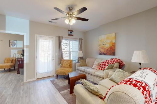 a living room with a couch and a ceiling fan at Vinyards Terrace 3112 S Vineyards Terrace 1 in Branson