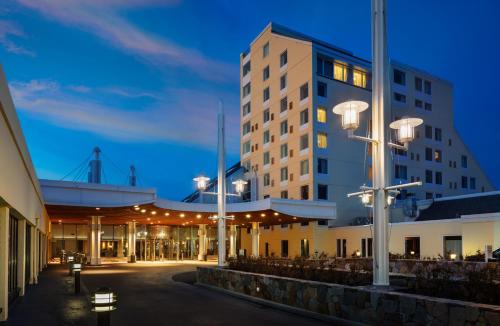 a large building with lights on the side of it at Newport Harbor Island Resort in Newport