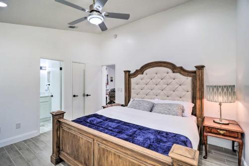 a bedroom with a large bed and a ceiling fan at Casa Azul Modern Ponte Vedra Beach Bungalow in Ponte Vedra Beach