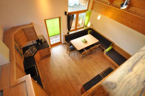 an overhead view of a table and chairs in a room at Apartment Lacklhof in Großkirchheim