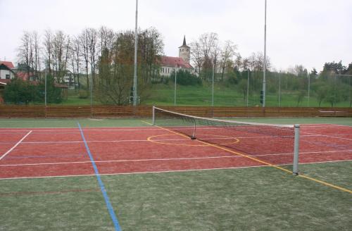 a tennis court with a net on top of it at Pension Rothschildův dvůr in Bělá