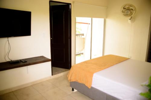 TV a/nebo společenská místnost v ubytování Finca Hotel Loma Verde