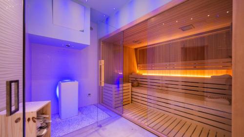 a bathroom with purple lights and a refrigerator in it at HOTEL CENTER 2 in Rome