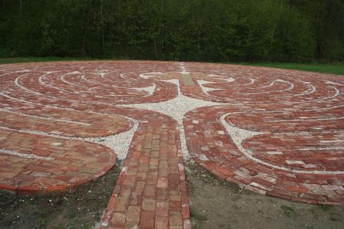 a large brick labyrinth in the middle of a park at Pension Rothschildův dvůr in Bělá