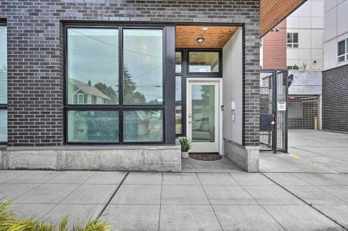 a brick building with a door with a potted plant at Stylish Ballard studio 15 mins from Space Needle in Seattle