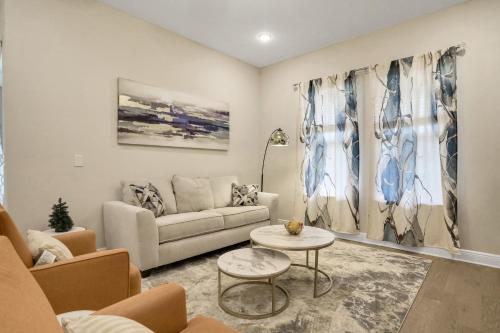 a living room with a couch and a table at Newport Retreat in Tampa