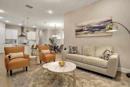 a living room with a couch and a table at Newport Retreat in Tampa
