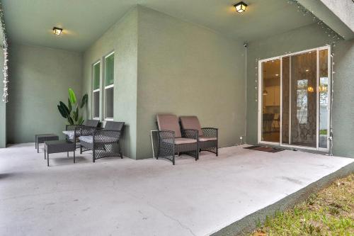 a patio with chairs and a table on a house at Newport Retreat in Tampa