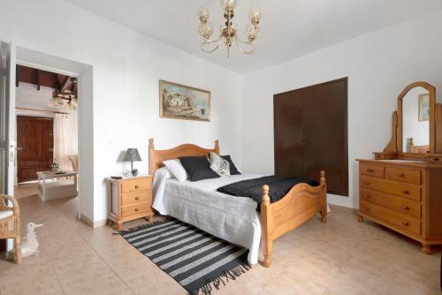 A bed or beds in a room at Casa Haba