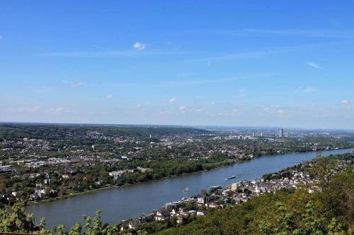 an aerial view of a river with a city at Haus Hillebrand in Bad Honnef am Rhein
