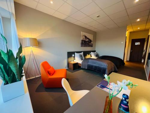 Ένα ή περισσότερα κρεβάτια σε δωμάτιο στο Aircraft Hotel & Events