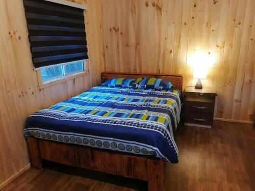 Ein Bett oder Betten in einem Zimmer der Unterkunft Acogedora cabaña para descansar en Caburgua