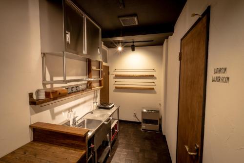 a kitchen with a sink and a counter top at LifeHouse IPPO in Otaru