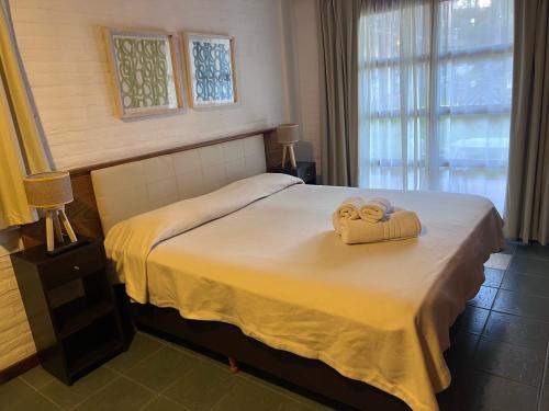 Cariló Paradise Apart Hotel & Spaにあるベッド