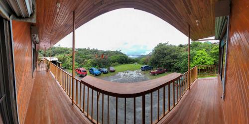 a large balcony with a view of a parking lot at Cabinas Selva Verde in Monteverde Costa Rica