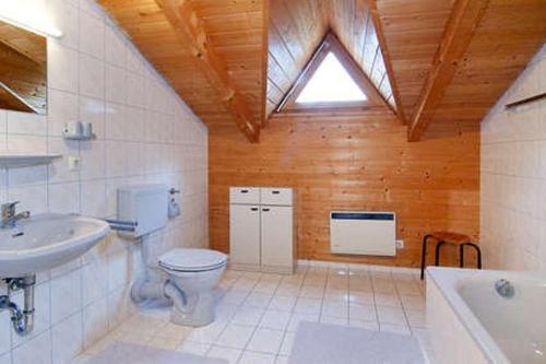 a bathroom with a toilet and a sink at Haus-am-Wald in Regen