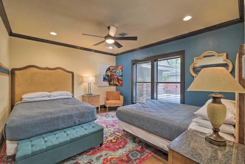 a bedroom with a bed and a ceiling fan at Eclectic Houston Home Less Than 4 Mi to Downtown! in Houston