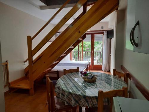 a dining room table with a bowl of fruit on it at Super Apart in Miramar