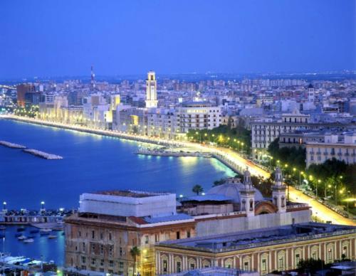 a view of a city with a river and a bridge at Hotel Giardino in Modugno