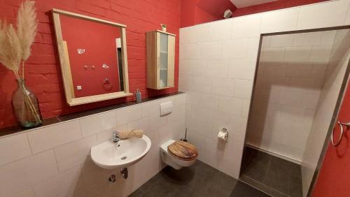 a bathroom with a sink and a toilet at Spreewald Spreemilia Gurkenbude in Lübbenau