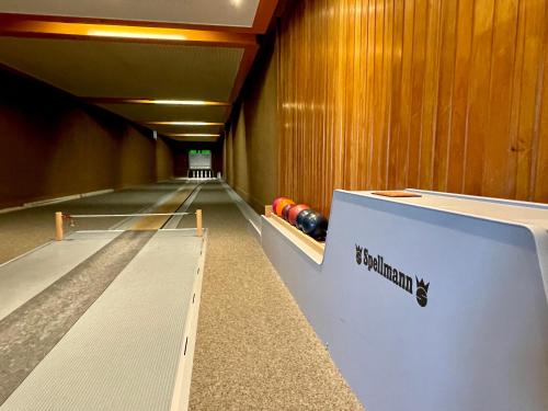 an empty bowling alley with balls on the lanes at Lemmerhof in Eslohe