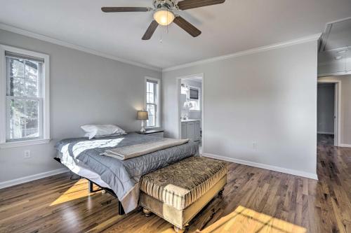 a bedroom with a bed and a ceiling fan at Charming Spring Lake Retreat, 1 Mi to Beach! in Spring Lake