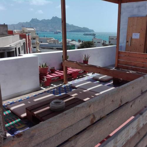 a balcony with a view of the ocean at Apart Laginha in Mindelo